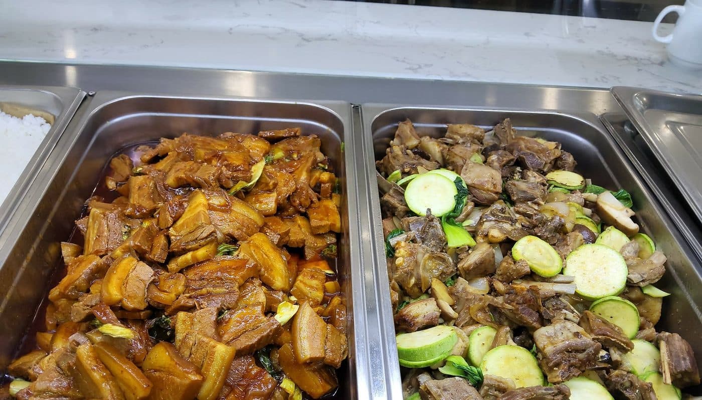 Meat dishes in hot serving trays