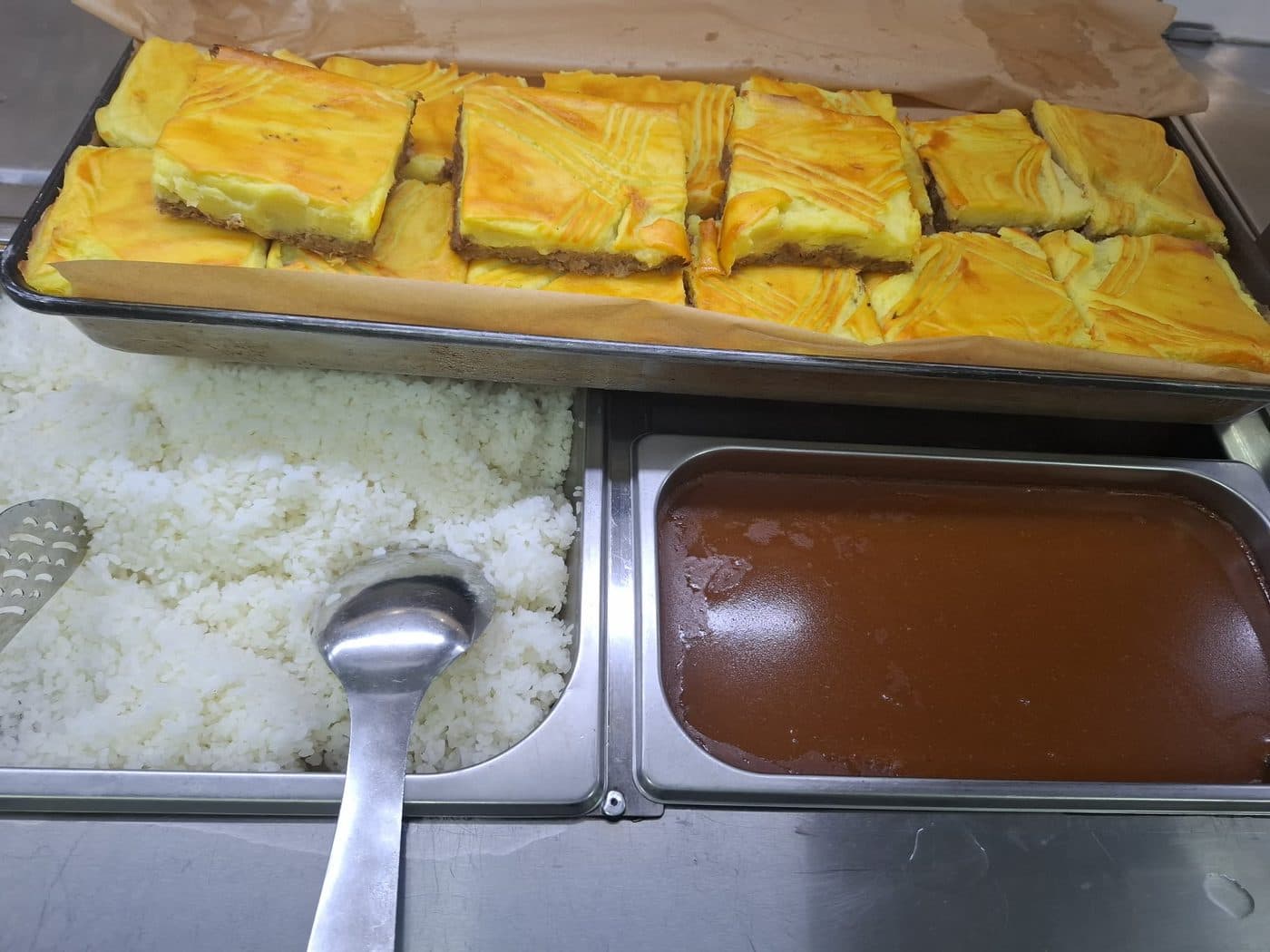 Rice and soup on the serving line