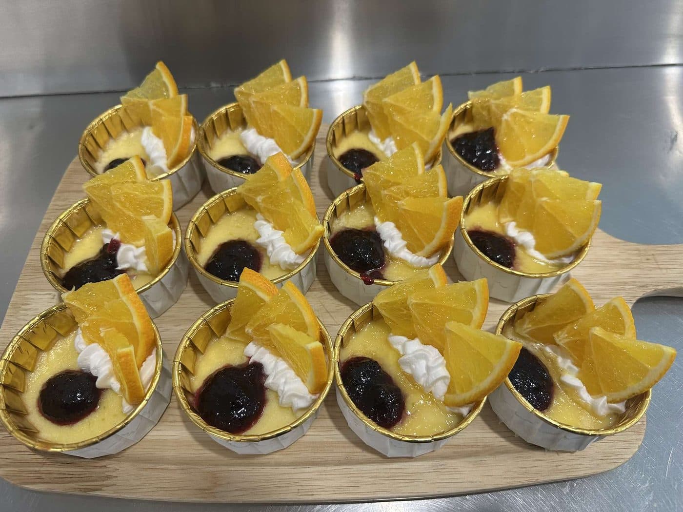 Tray of tartlets garnished with orange